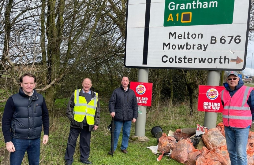 Gareth Davies MP with litter pickers by the A1