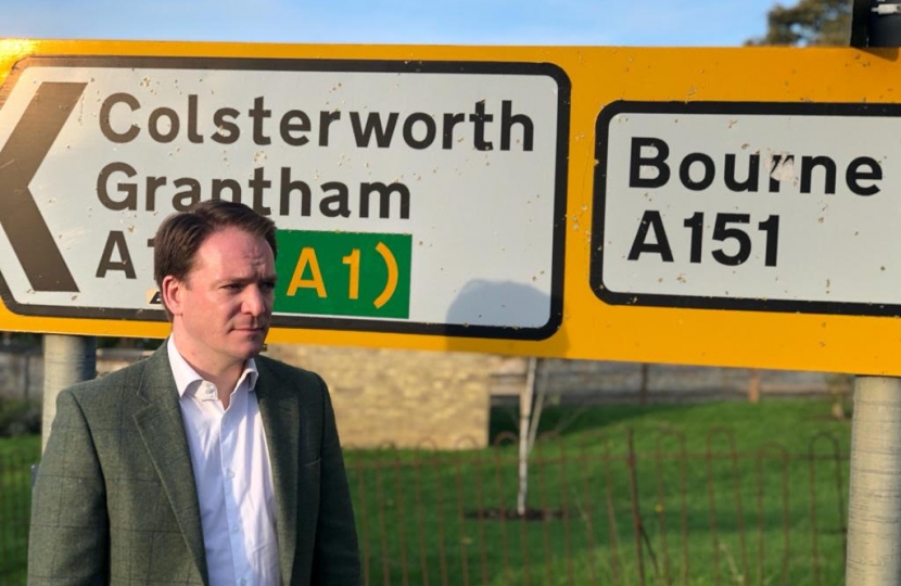 Gareth Davies MP in front of Colsterworth Road sign