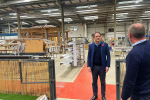 Gareth Davies MP on factory floor of Vale Garden Homes