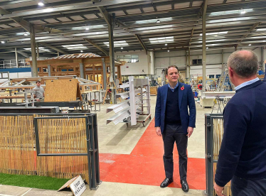 Gareth Davies MP on factory floor of Vale Garden Homes